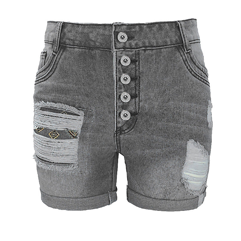 Dame denim-shorts med moderne ripped-design og farverige indlæg Stilla