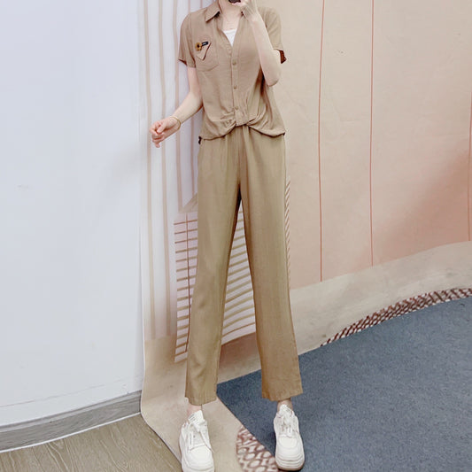 Dame afslappet jumpsuit med knapbart overdel og elegant taljebehandling Stilla
