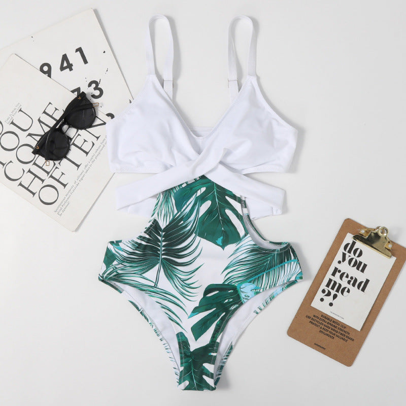 Dame jumpsuit-badedragt med floral udskæring og moderigtigt kryds-design Stilla