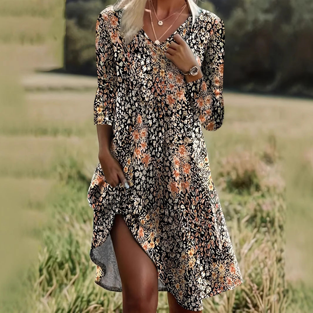 Dame afslappet midikjole med blomsterprint og asymmetrisk kant Stilla