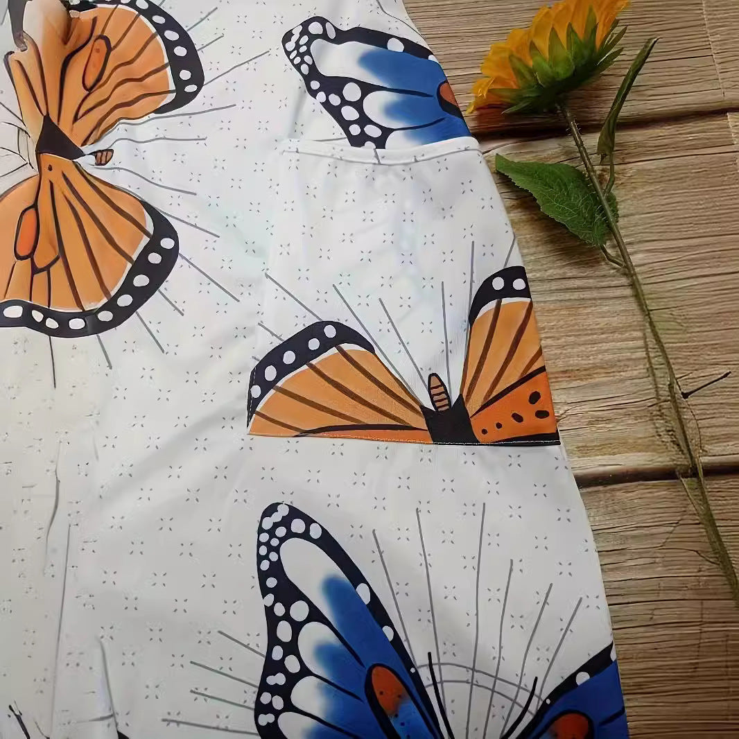 Dame jumpsuit med farverigt sommerfuglemønster og praktiske lommer Stilla