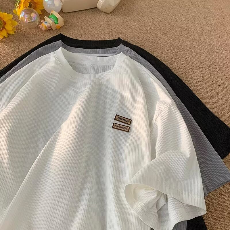 Dame afslappet T-shirt med struktureret stof og moderigtig logo Stilla