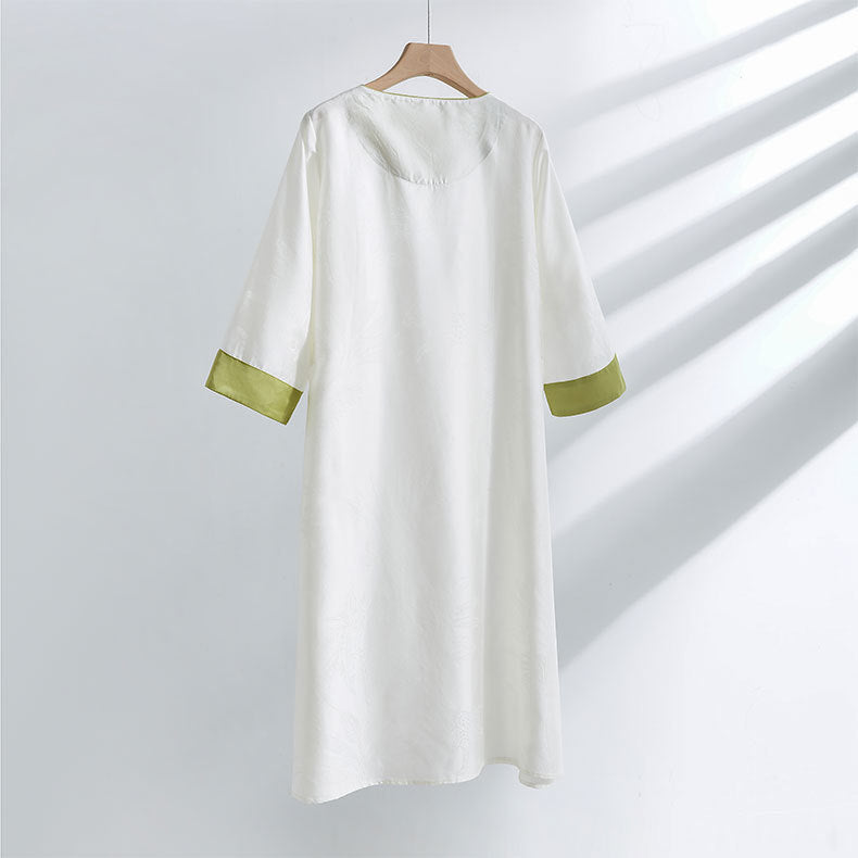 Dame bluse top med blomstret relief og elegant knaplukning Stilla