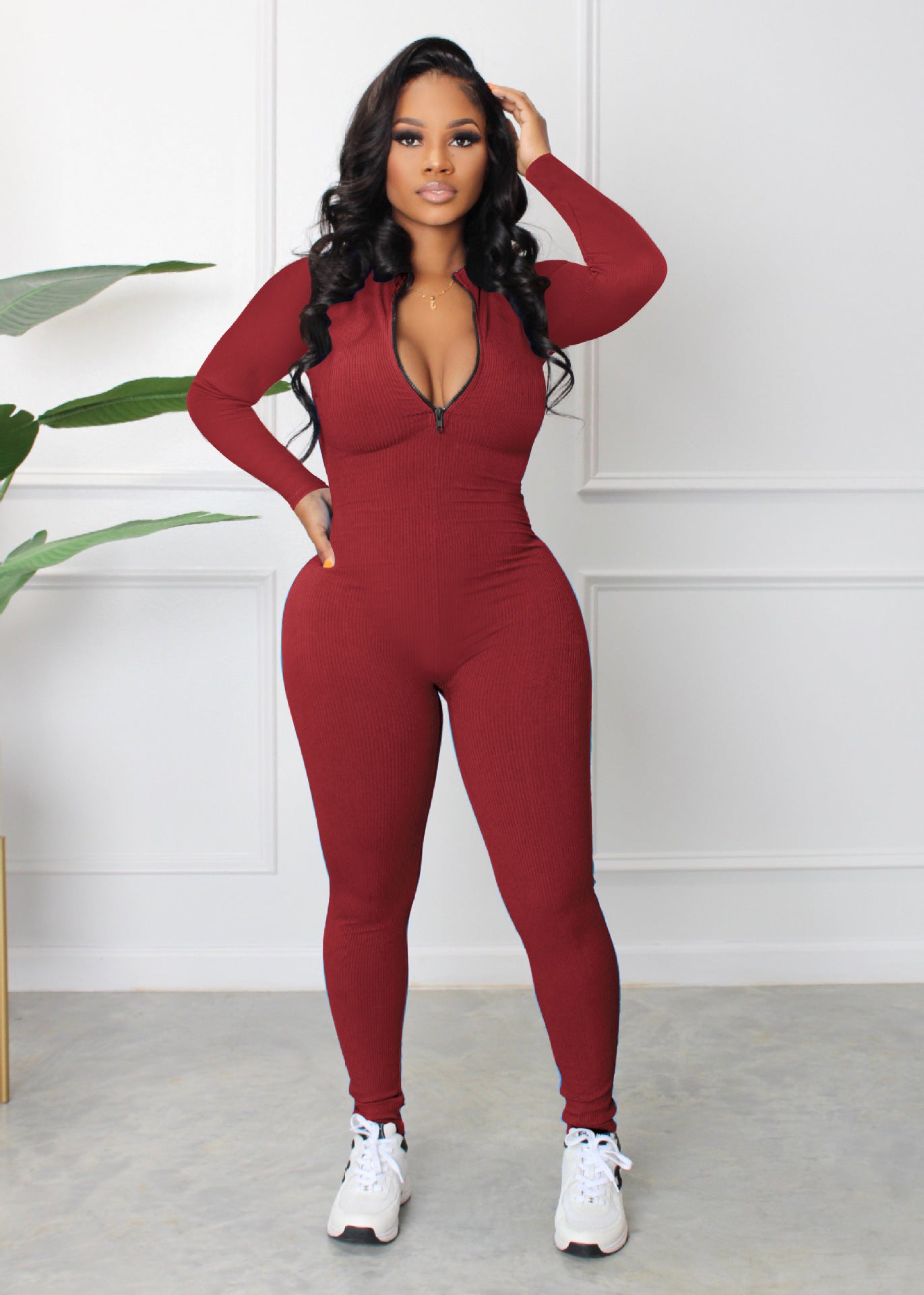 Dame sporty langærmet jumpsuit med lynlås og tætsiddende snit Stilla