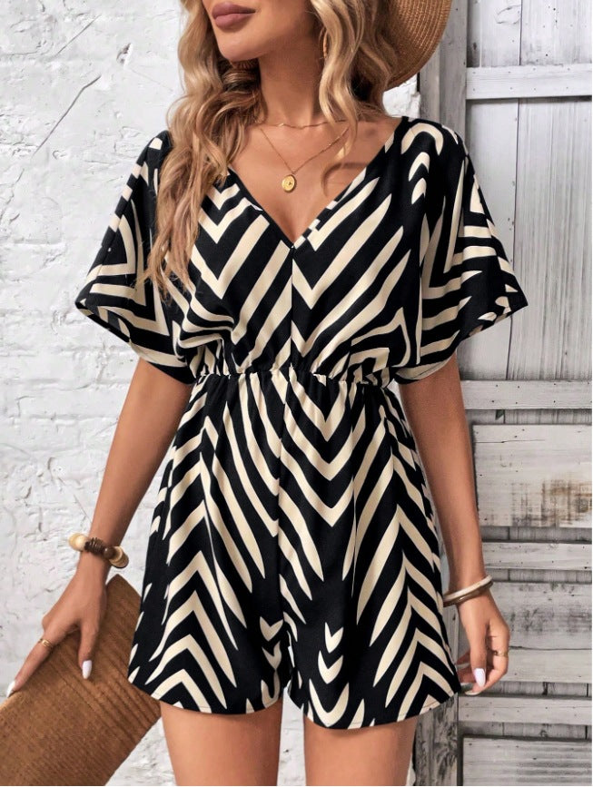 Dame moderigtig jumpsuit med omfattende indpakningslook og grafisk mønster Stilla