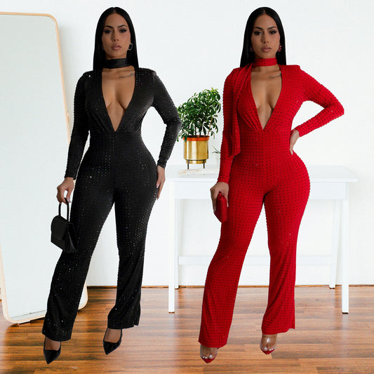 Dame glamorøs jumpsuit med dyb v-udskæring og lange ærmer Stilla