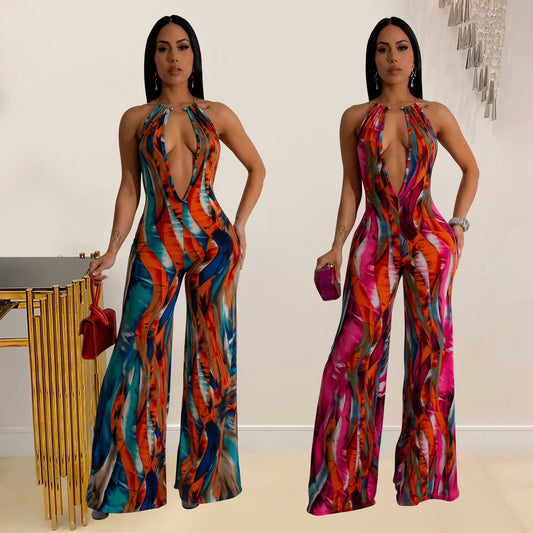 Dame Riviera-inspireret jumpsuit med dyb udskæring og bredt ben Stilla