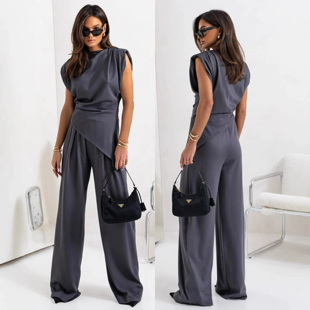 Dame jumpsuit med asymmetrisk design og bredt skårne bukser Stilla