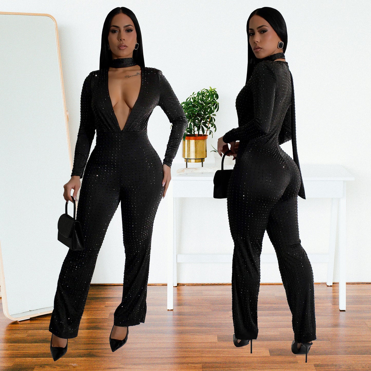 Dame glamorøs jumpsuit med dyb v-udskæring og lange ærmer Stilla