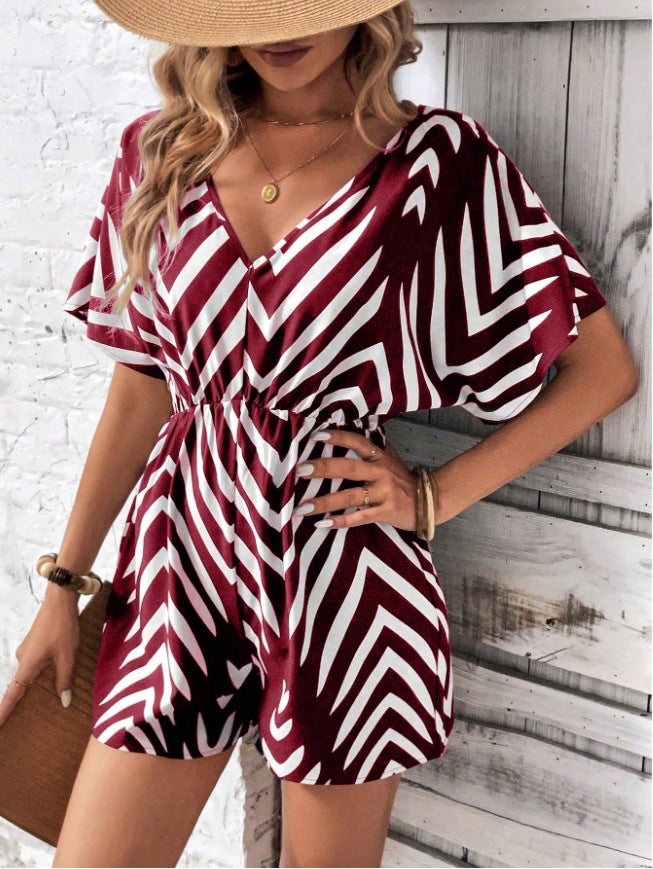 Dame moderigtig jumpsuit med omfattende indpakningslook og grafisk mønster Stilla