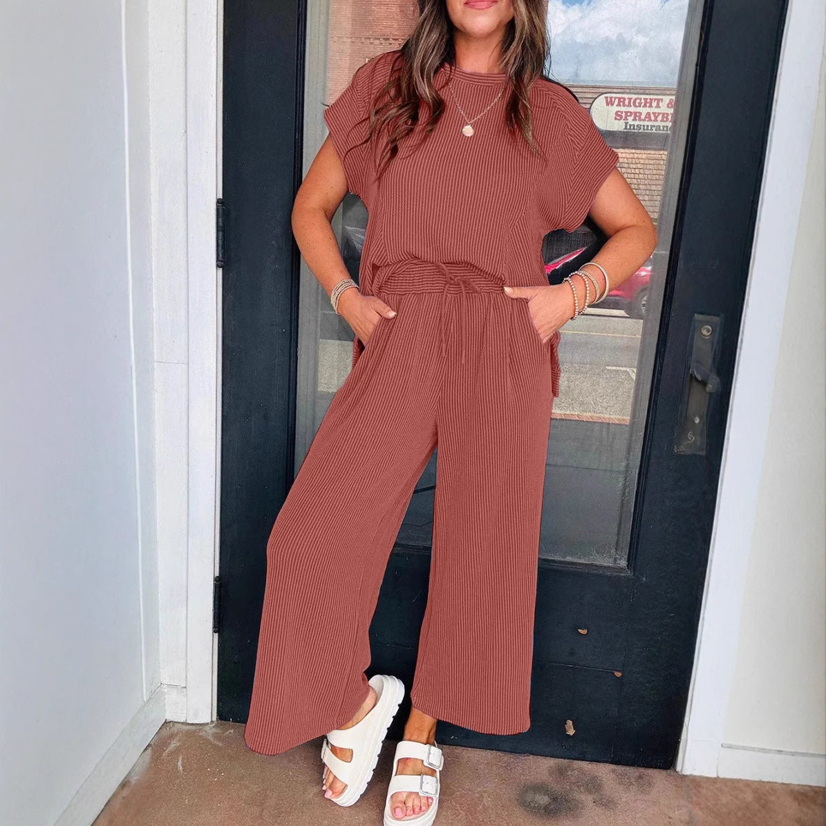 Dame afslappet strik-jumpsuit med brede ben og elastisk talje Stilla