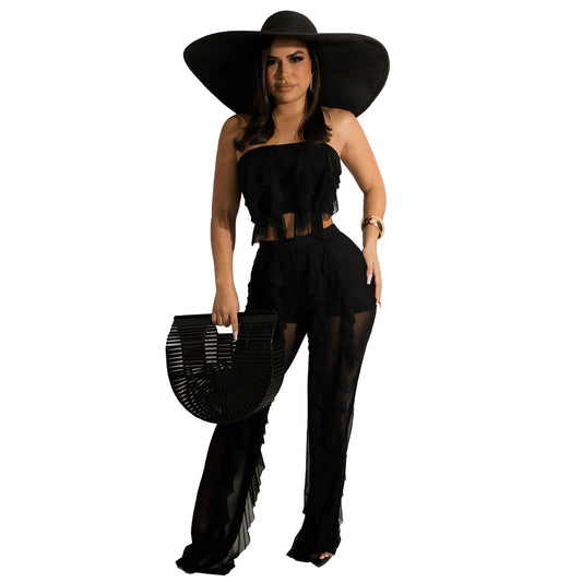 Dame jumpsuit med voluminøse flæser og off-shoulder design Stilla