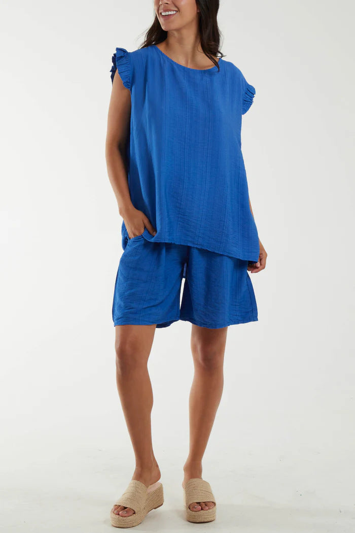 Dame afslappet kortærmet sæt med flæsedetaljer og praktiske lommer Stilla