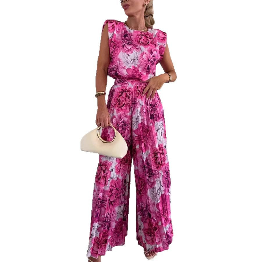 Dame jumpsuit med flydende blomsterprint og elegant talje Stilla